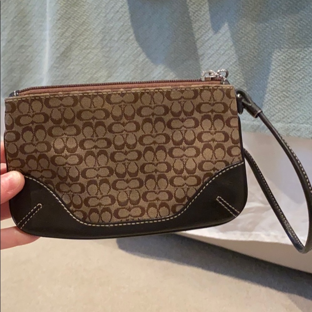 Brown and tan C coach wristlet